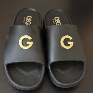 GBG Los Angeles Black and Gold Slide Sandals